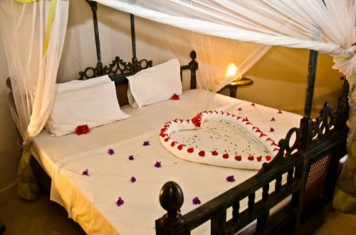 Romantic double bedroom at Palumbo Kendwa, Zanzibar. Travel with World Lifetime Journeys