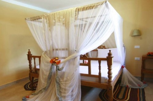 Romantic double bedroom at Palumbo Reef, Zanzibar. Travel with World Lifetime Journeys