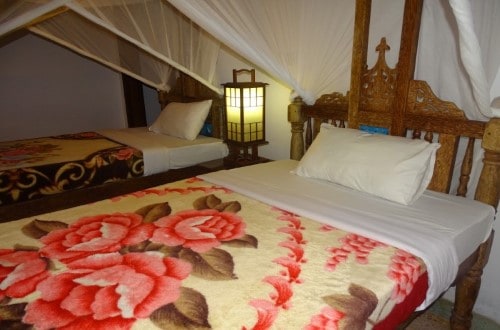 Room Twin beds at Ras Michamvi. Travel with World Lifetime Journeys