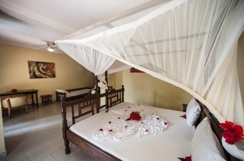 Standard double bedroom with third bed at Palumbo Reef, Zanzibar. Travel with World Lifetime Journeys