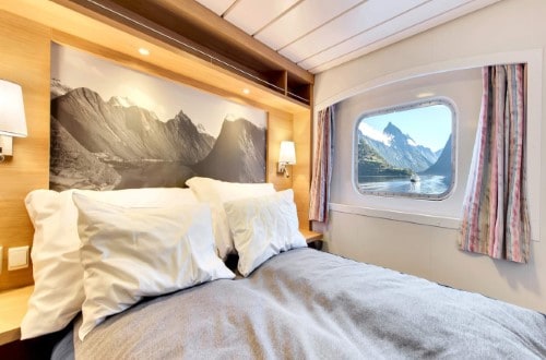 Suite on Kong Harald on Northern Lights round voyage. Travel with World Lifetime Journeys
