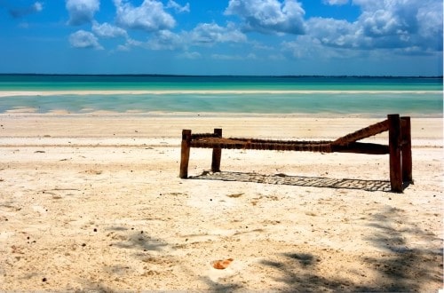 Sunbath at the ocean at Palumbo Reef, Zanzibar. Travel with World Lifetime Journeys