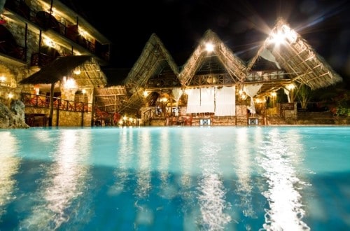 Swimming pool in the evening at Samaki Lodge, Zanzibar. Travel with World Lifetime Journeys