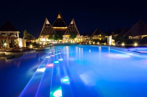 Swimming pool in the night at Essque Zalu, Zanzibar. Travel with World Lifetime Journeys