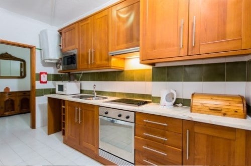 Three bedroom apartment kitchen at Choro Mar Apartments in Albufeira, Portugal. Travel with World Lifetime Journeys