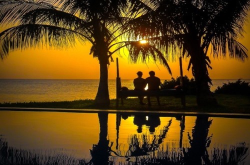 Watching sunset at Fumba Beach Lodge, Zanzibar. Travel with World Lifetime Journeys