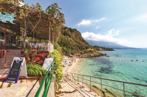 Beach side at Karavados Beach Hotel in Kefalonia Island, Greece. Travel with World Lifetime Journeys