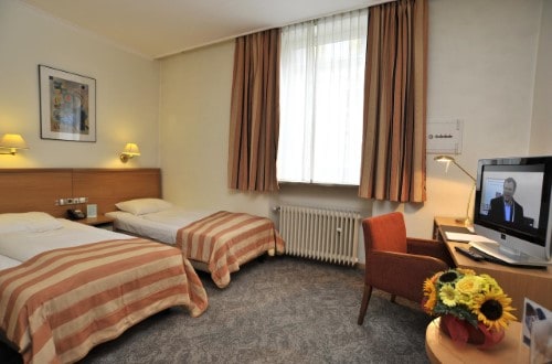 Twin room at Golden Tulip Central Molitor in Luxembourg city. Travel with World Lifetime Journeys