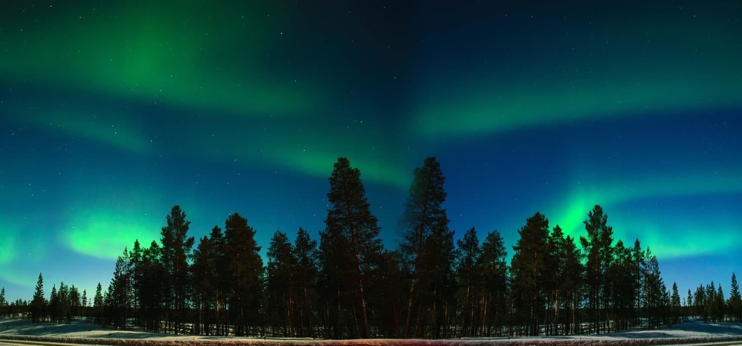 Beautiful aurora borealis or northern lights in Finland. Travel with World Lifetime Journeys