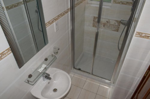 Ensuite bathroom at Leigham Court Hotel in London, United Kingdom. Travel with World Lifetime Journeys