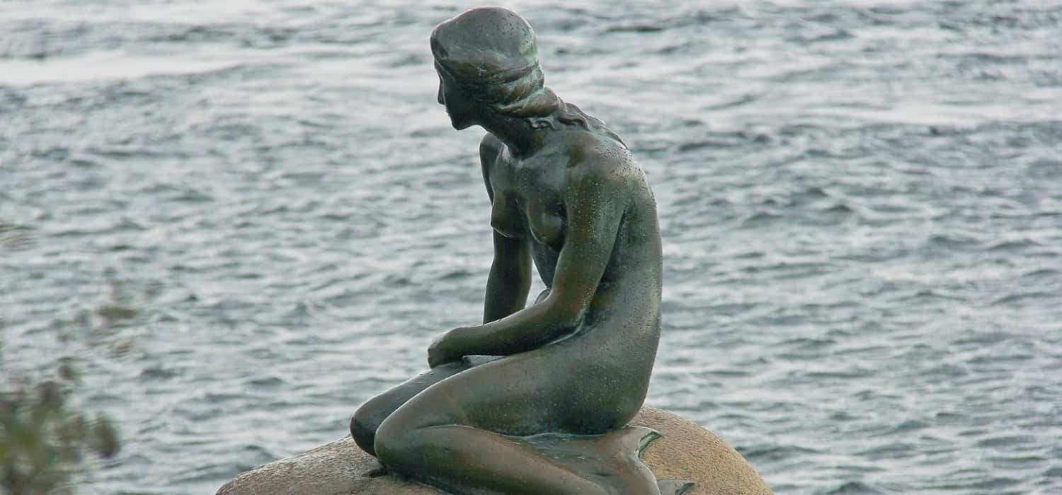 Little mermaid statue in Copenhagen, Denmark. Travel with World Lifetime Journeys