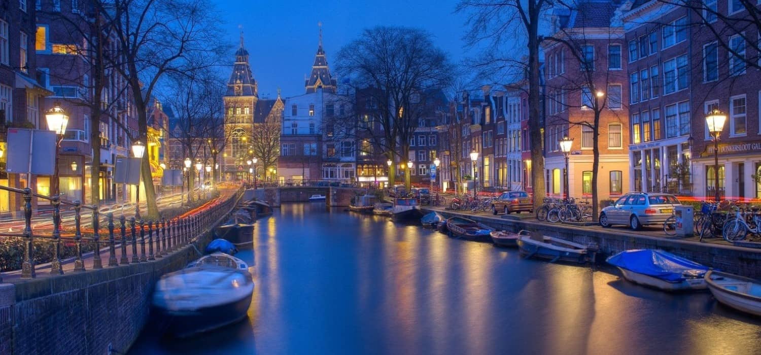 Night time on canals in Amsterdam, Netherlands. Travel with World Lifetime Journeys