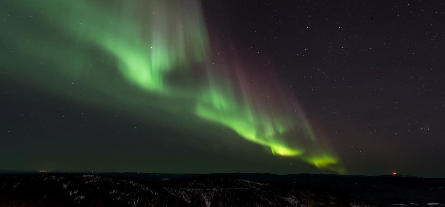 Northern Lights over Finland. Travel with World Lifetime Journeys