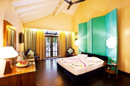 Room Interior with Honeymoon Decor at Adaaran Select Meedhupparu. Travel with World Lifetime Journeys