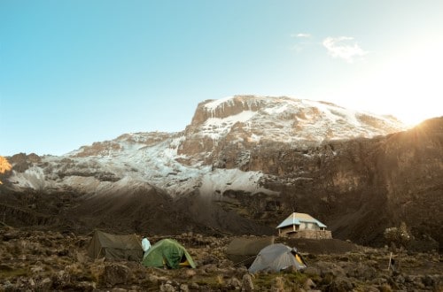 Huts and tents on Kilimanjaro mountain. Travel with World Lifetime Journeys