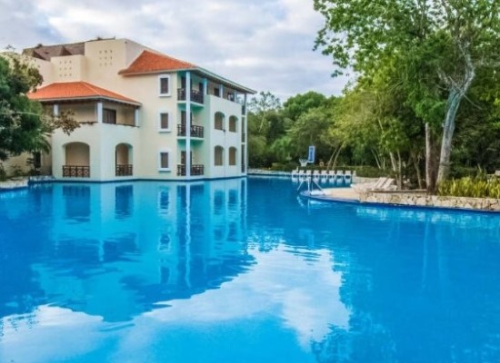 Swimming pool at Occidental Xcaret Destination Mexico. Travel with World Lifetime Journeys