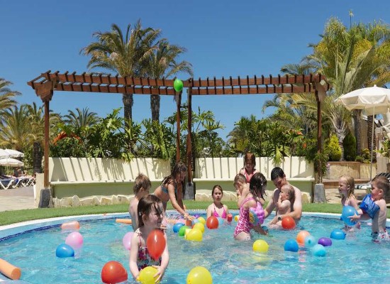 Summer family beach holiday Spain Gran oasis resort Canaries. Travel with World Lifetime Journeys